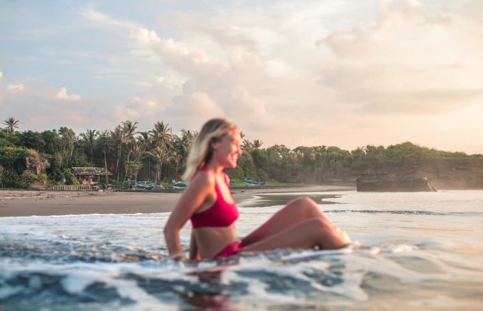 Girl swimming in the sea in a tropical paradise